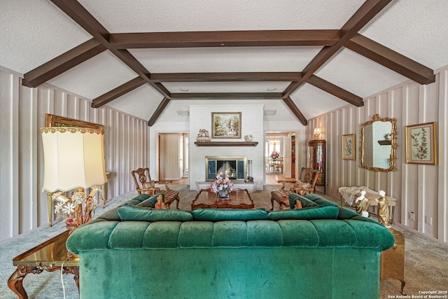 11 El Norte Cir, Uvalde, TX 78801 - living area featuring carpet floors, a fireplace, and a textured ceiling