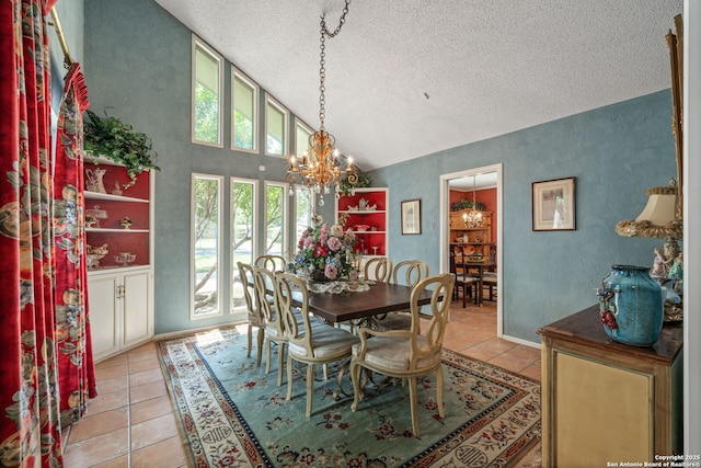 11 El Norte Cir, Uvalde, TX 78801 - dining room with a textured ceiling, a chandelier, light tile patterned floors, vaulted ceiling, and a textured wall