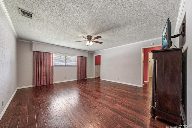 11 El Norte Cir, Uvalde, TX 78801 - spare room with ceiling fan, ornamental molding, wood-type flooring, a textured ceiling, and a textured wall