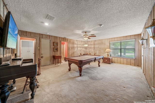 11 El Norte Cir, Uvalde, TX 78801 - recreation room with billiards, carpet floors, wood walls, ceiling fan, and a textured ceiling
