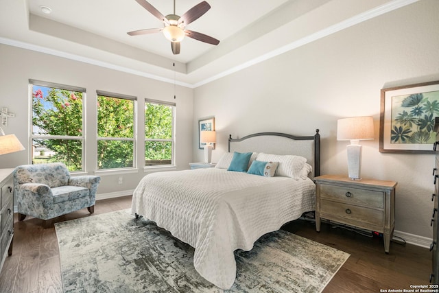 140 Cinnamon Crk, Boerne, TX 78006 - bedroom with a tray ceiling, baseboards, wood finished floors, ceiling fan, and ornamental molding