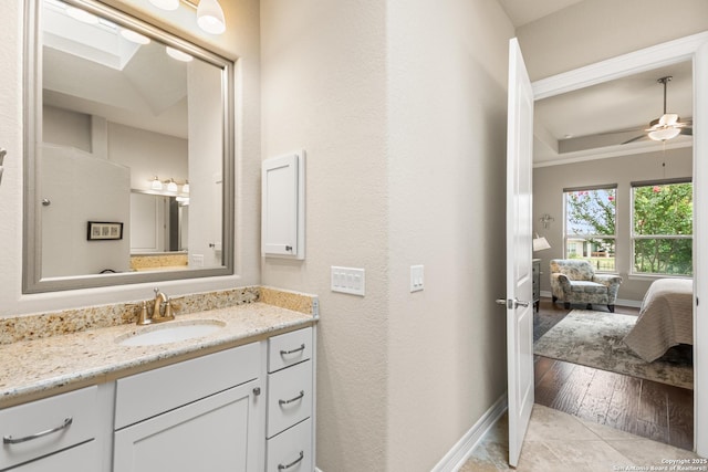 140 Cinnamon Crk, Boerne, TX 78006 - bathroom with vanity, ensuite bathroom, baseboards, and a ceiling fan