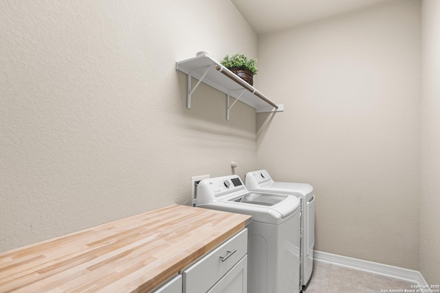 140 Cinnamon Crk, Boerne, TX 78006 - laundry area featuring washing machine and clothes dryer, light tile patterned floors, and baseboards