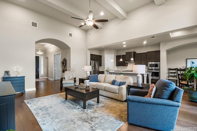 140 Cinnamon Crk, Boerne, TX 78006 - living area featuring a ceiling fan, arched walkways, high vaulted ceiling, wood finished floors, and baseboards