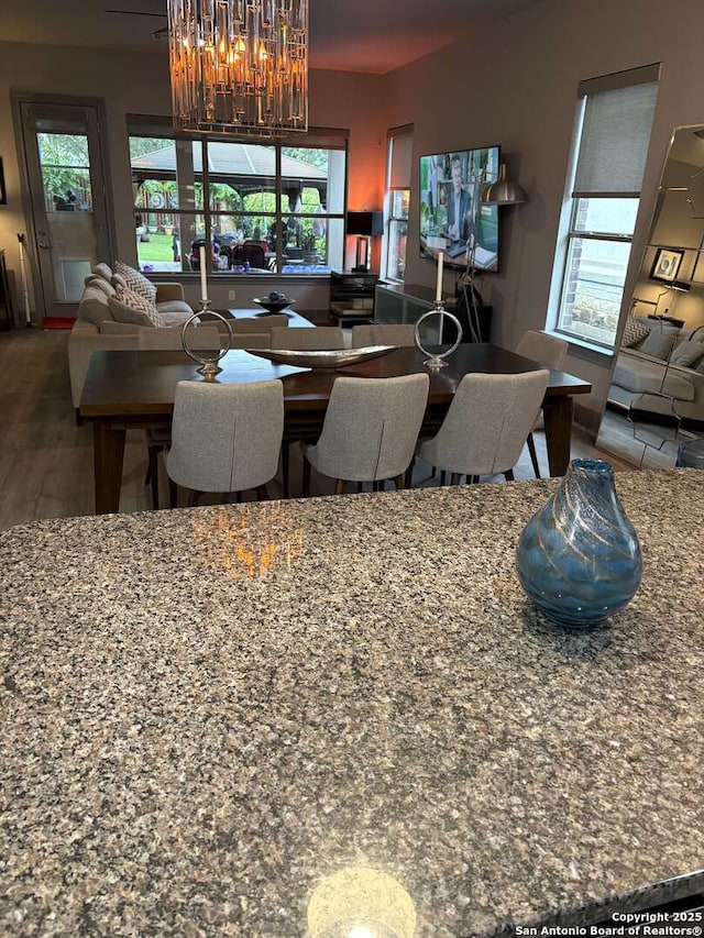 636 Carriage House # 30, Spring Branch, TX 78070 - dining space with a chandelier and wood finished floors