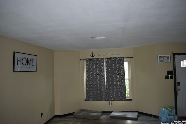 8328 Morning Grv, Converse, TX 78109 - spare room featuring wood finished floors and baseboards