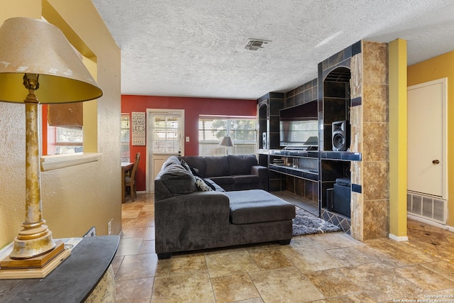 1019 Cloverbrook, San Antonio, TX 78245 - living area featuring a textured ceiling and baseboards