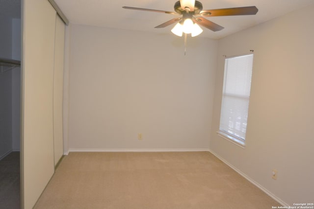 426 Twin Point Crk, Schertz, TX 78154 - unfurnished bedroom with light carpet, baseboards, a closet, and ceiling fan