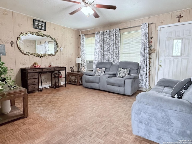 2407 Aiken, San Antonio, TX 78237 - living room featuring a ceiling fan and wood walls