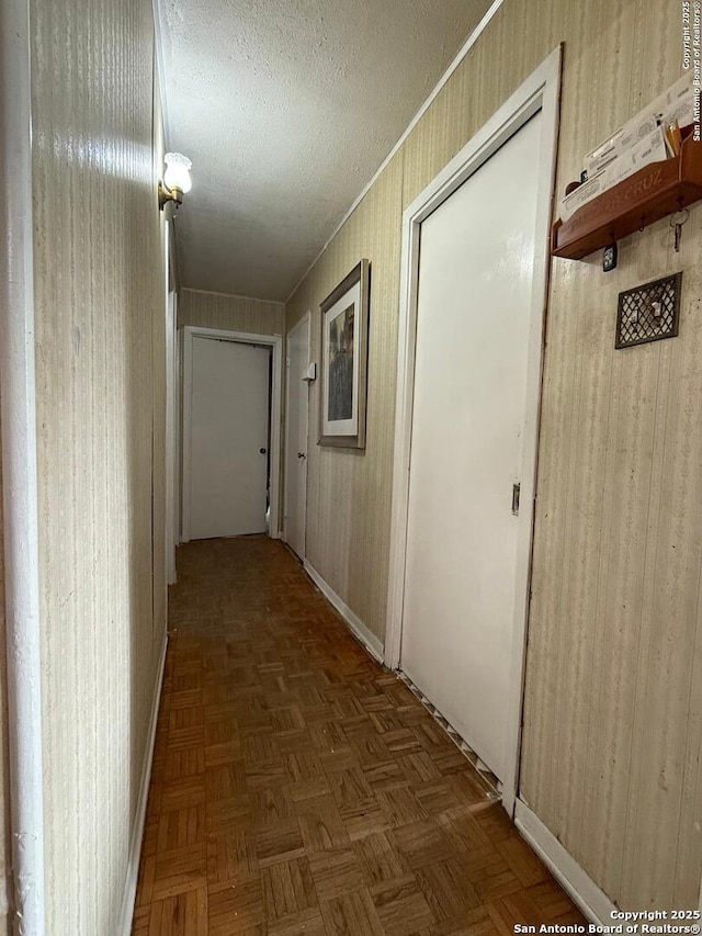 2407 Aiken, San Antonio, TX 78237 - hall with baseboards and a textured ceiling