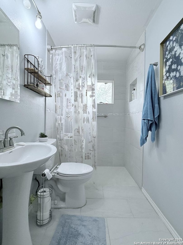 2407 Aiken, San Antonio, TX 78237 - bathroom with toilet and tiled shower