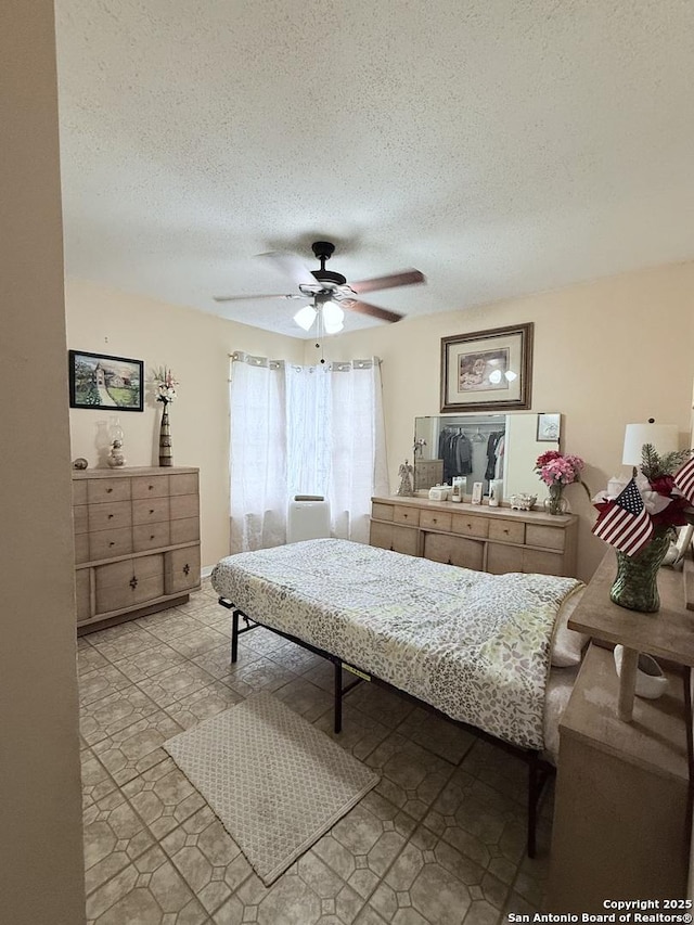 2407 Aiken, San Antonio, TX 78237 - bedroom with a textured ceiling and a ceiling fan