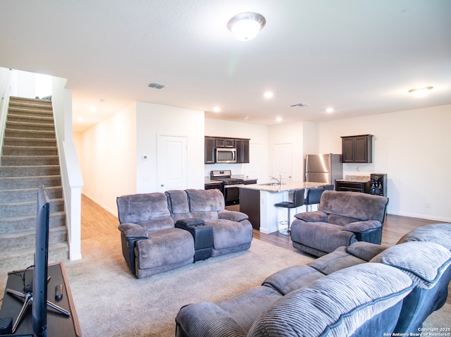 13514 Flower Pond, Saint Hedwig, TX 78152 - living room featuring stairs, recessed lighting, and baseboards