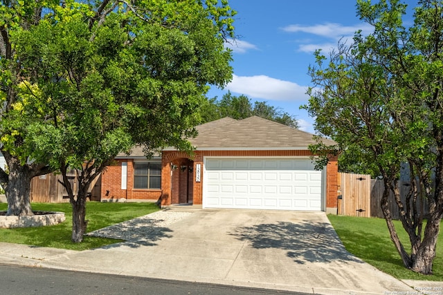 13930 Grove Patch, San Antonio, TX 78247 - view of front of home featuring a garage, driveway, and brick siding