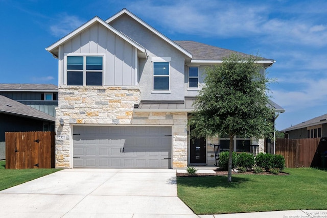 2331 Greystone Lndg, San Antonio, TX 78259 - view of front facade featuring stone siding, board and batten siding, a garage, and concrete driveway