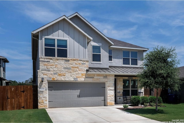 2331 Greystone Lndg, San Antonio, TX 78259 - view of front of house with stone siding, a garage, board and batten siding, and a standing seam roof