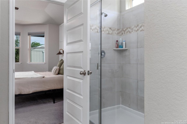 2331 Greystone Lndg, San Antonio, TX 78259 - bathroom featuring a textured wall, connected bathroom, and a shower stall