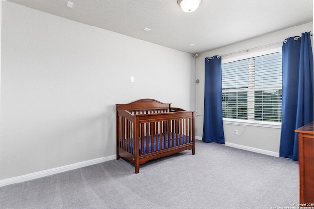 2331 Greystone Lndg, San Antonio, TX 78259 - bedroom with baseboards, carpet flooring, and a nursery area