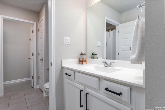 2331 Greystone Lndg, San Antonio, TX 78259 - full bathroom featuring vanity, tile patterned floors, and toilet