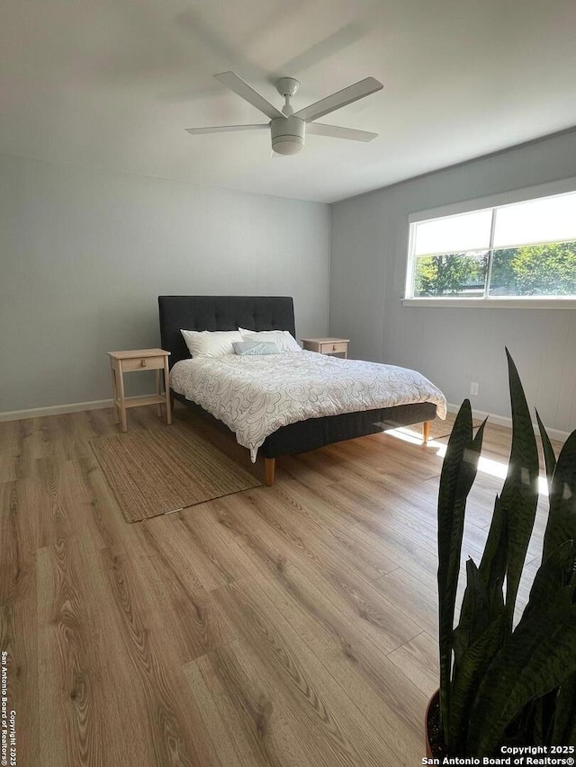 3002 Wroxton, San Antonio, TX 78217 - bedroom featuring wood finished floors, a ceiling fan, and baseboards
