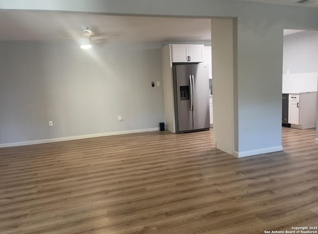 3002 Wroxton, San Antonio, TX 78217 - unfurnished room featuring wood finished floors, baseboards, and a ceiling fan