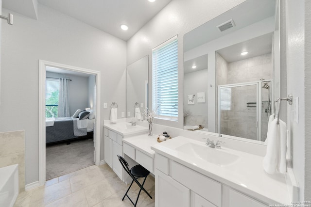 1524 Leeds Park, Bulverde, TX 78163 - ensuite bathroom featuring double vanity, a bath, a stall shower, tile patterned floors, and baseboards