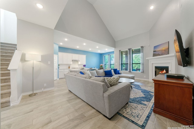 1524 Leeds Park, Bulverde, TX 78163 - living area featuring a glass covered fireplace, high vaulted ceiling, stairway, recessed lighting, and baseboards