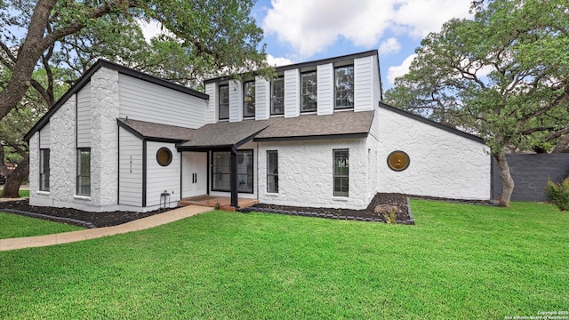 1818 Moreshead, San Antonio, TX 78231 - view of front of house with a front lawn, roof with shingles, and stone siding