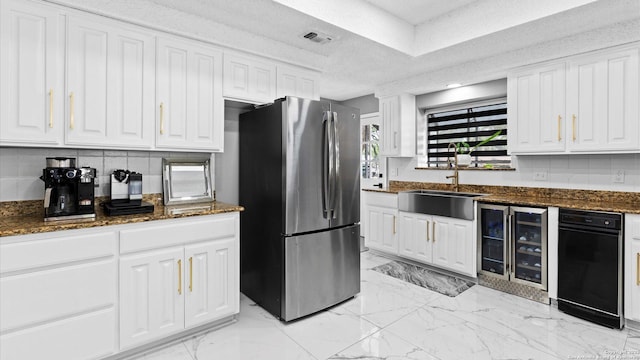 1818 Moreshead, San Antonio, TX 78231 - kitchen with freestanding refrigerator, wine cooler, and white cabinetry