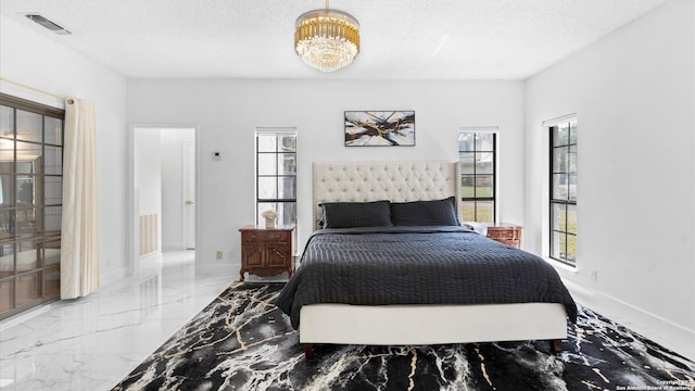1818 Moreshead, San Antonio, TX 78231 - bedroom with marble tiled floors, multiple windows, a textured ceiling, and baseboards