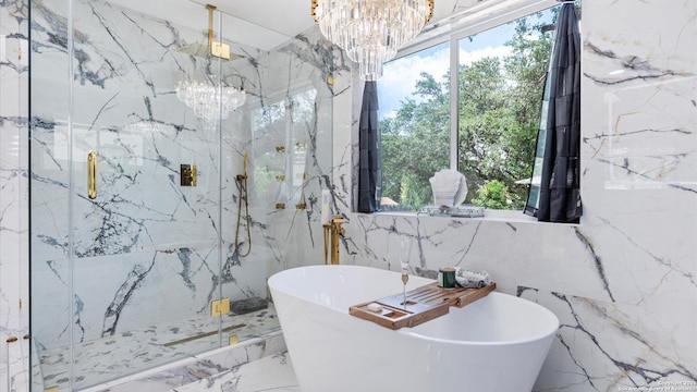 1818 Moreshead, San Antonio, TX 78231 - bathroom featuring marble tiled floors, tile walls, a marble finish shower, a freestanding tub, and a chandelier