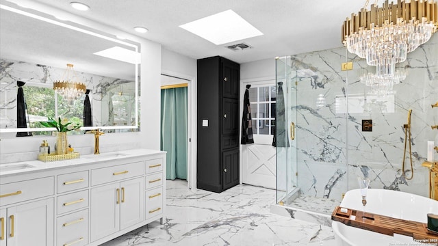 1818 Moreshead, San Antonio, TX 78231 - full bathroom featuring a chandelier, a skylight, a marble finish shower, a freestanding bath, and double vanity