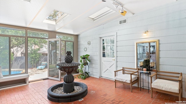1818 Moreshead, San Antonio, TX 78231 - sunroom featuring lofted ceiling, a skylight, rail lighting, and plenty of natural light