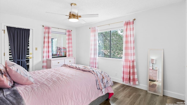 1818 Moreshead, San Antonio, TX 78231 - bedroom featuring wood finished floors, baseboards, a ceiling fan, and a textured ceiling