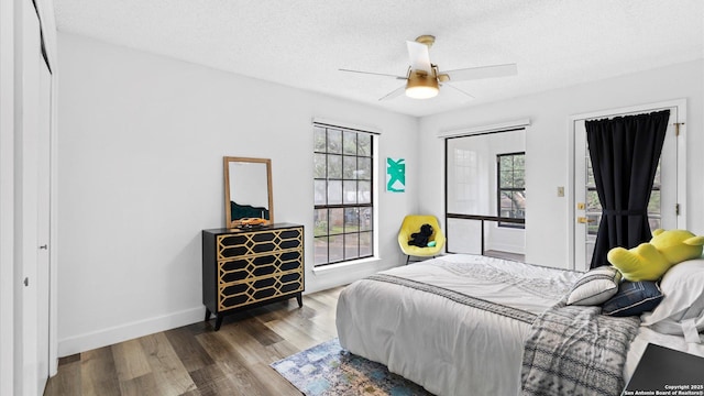 1818 Moreshead, San Antonio, TX 78231 - bedroom featuring wood finished floors, a textured ceiling, ceiling fan, and baseboards