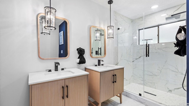 1818 Moreshead, San Antonio, TX 78231 - bathroom featuring a marble finish shower, two vanities, marble finish flooring, and recessed lighting
