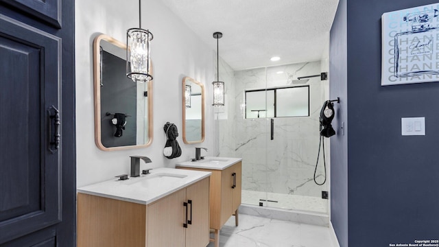 1818 Moreshead, San Antonio, TX 78231 - bathroom with marble finish flooring, a marble finish shower, two vanities, and a textured ceiling