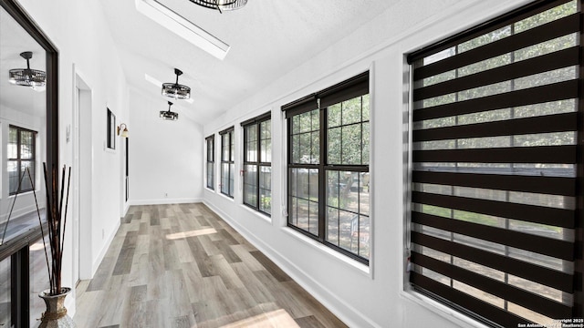 1818 Moreshead, San Antonio, TX 78231 - corridor with vaulted ceiling, wood finished floors, baseboards, and a skylight