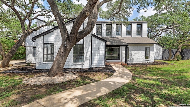 1818 Moreshead, San Antonio, TX 78231 - view of front of property with stone siding and a front yard