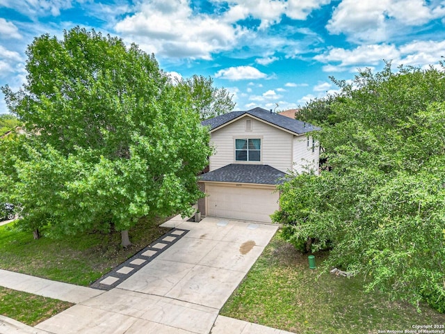 609 San Augustine, New Braunfels, TX 78132 - view of front of home with a garage, concrete driveway, and roof with shingles