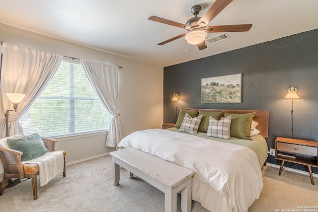 609 San Augustine, New Braunfels, TX 78132 - bedroom featuring light colored carpet, multiple windows, and baseboards