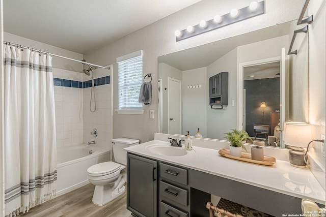 609 San Augustine, New Braunfels, TX 78132 - full bathroom featuring vanity, toilet, wood finished floors, and shower / bath combo
