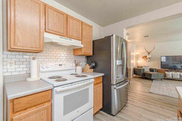 609 San Augustine, New Braunfels, TX 78132 - kitchen featuring electric range, under cabinet range hood, stainless steel refrigerator with ice dispenser, and light brown cabinets