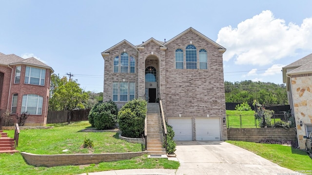 1031 Starlit Pond, San Antonio, TX 78260 - traditional-style house with concrete driveway, brick siding, a garage, and stairs