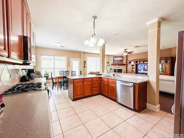 1031 Starlit Pond, San Antonio, TX 78260 - kitchen with appliances with stainless steel finishes, a sink, light countertops, and a ceiling fan