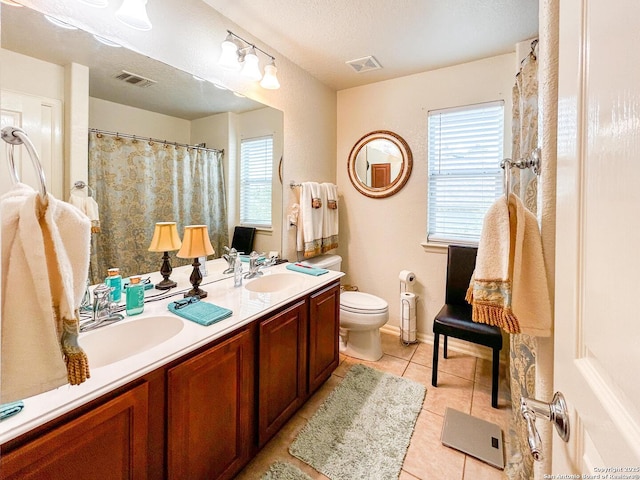 1031 Starlit Pond, San Antonio, TX 78260 - full bath with tile patterned flooring, toilet, healthy amount of natural light, and double vanity