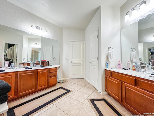 1031 Starlit Pond, San Antonio, TX 78260 - full bathroom with tile patterned flooring, a closet, two vanities, and baseboards