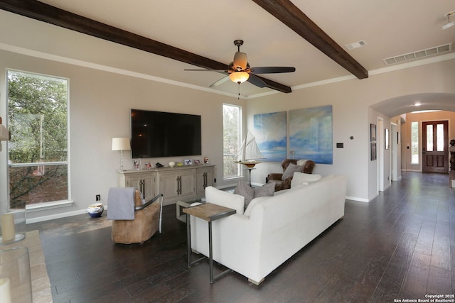 1818 Palmer Vw, San Antonio, TX 78260 - living room featuring beamed ceiling, arched walkways, baseboards, dark wood-style floors, and a ceiling fan