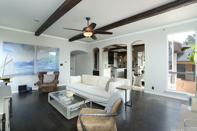 1818 Palmer Vw, San Antonio, TX 78260 - living room featuring arched walkways, beam ceiling, ceiling fan, wood finished floors, and baseboards