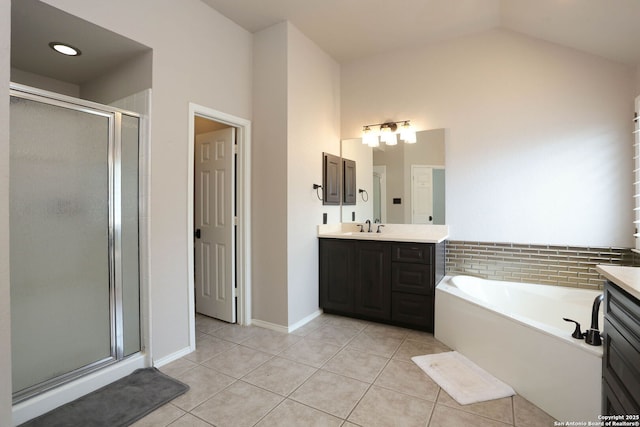 1818 Palmer Vw, San Antonio, TX 78260 - full bathroom with tile patterned floors, vanity, a shower stall, a bath, and vaulted ceiling